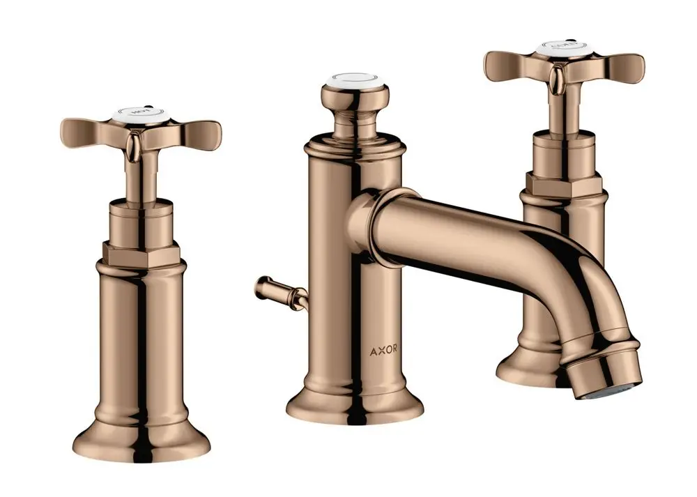 Dreiteilige Waschtischarmatur von AXOR mit zwei Kreuzgriffen und einem Auslauf, in einer Polished Red Gold-Oberfläche. Zugstangen-Ablaufgarnitur integriert.